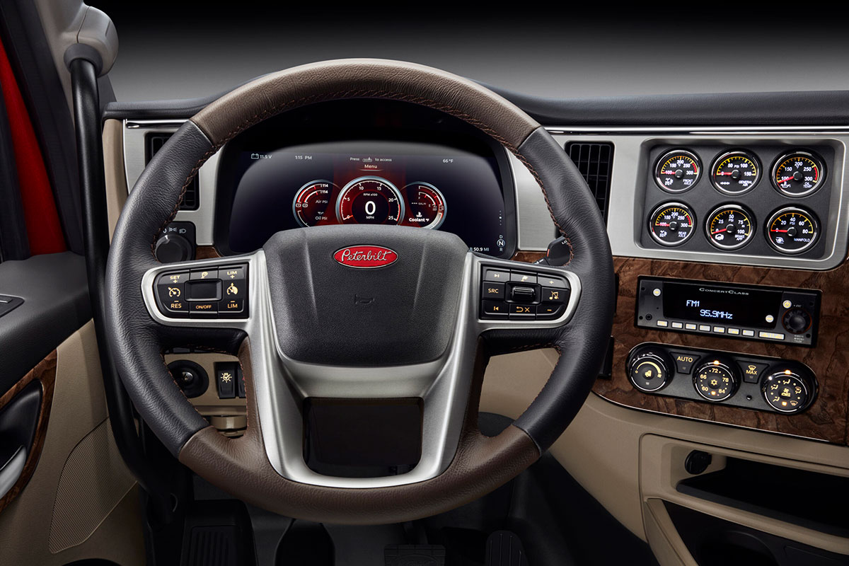 New Peterbilt 589 high roof sleeper interior featuring digital dash display and ergonomic steering wheel