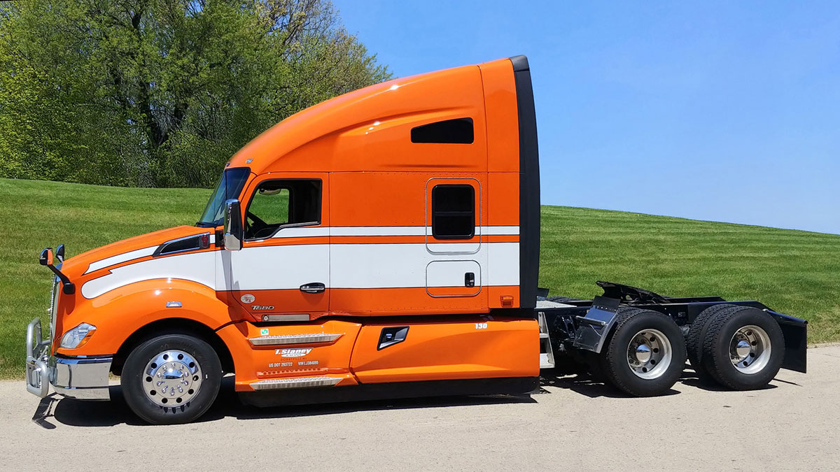 JX Graphics custom orange & white graphics on Kenworth T680
