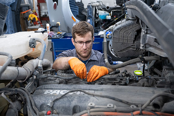 Service Tech working on engine