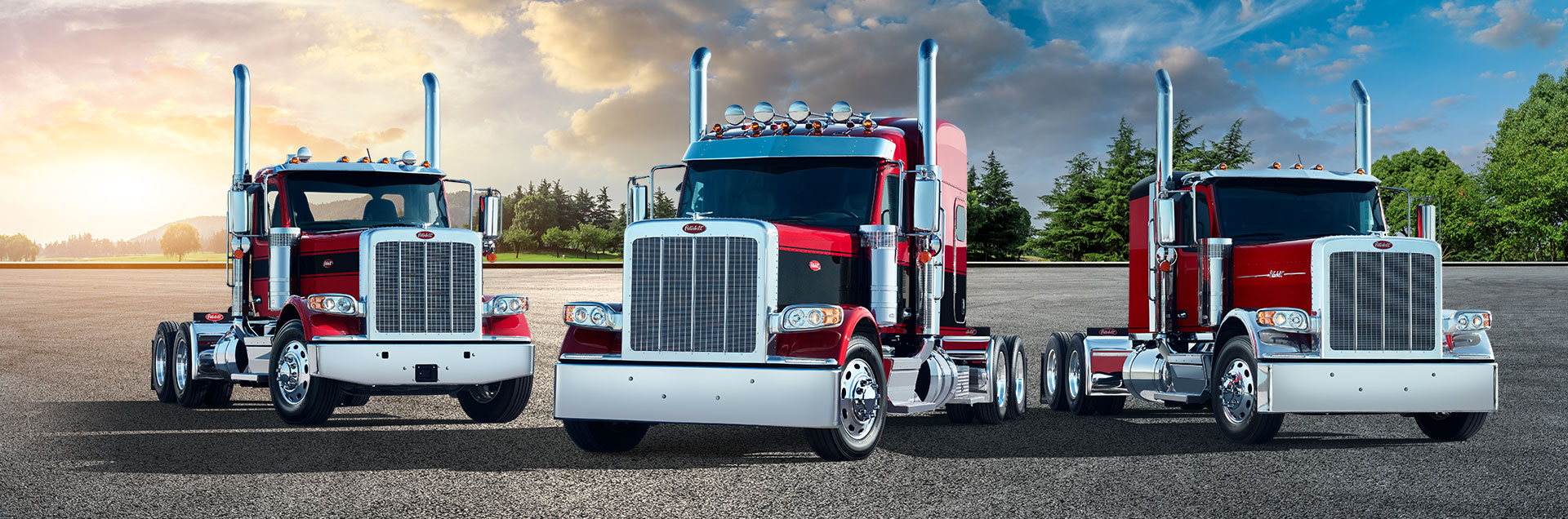 Lineup of new Peterbilt 589 trucks featuring dual chrome exhaust stacks