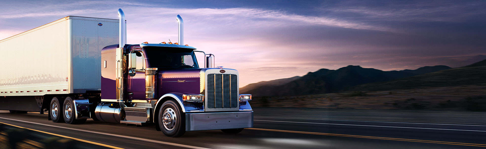 New Peterbilt 589 purple exterior side profile on highway