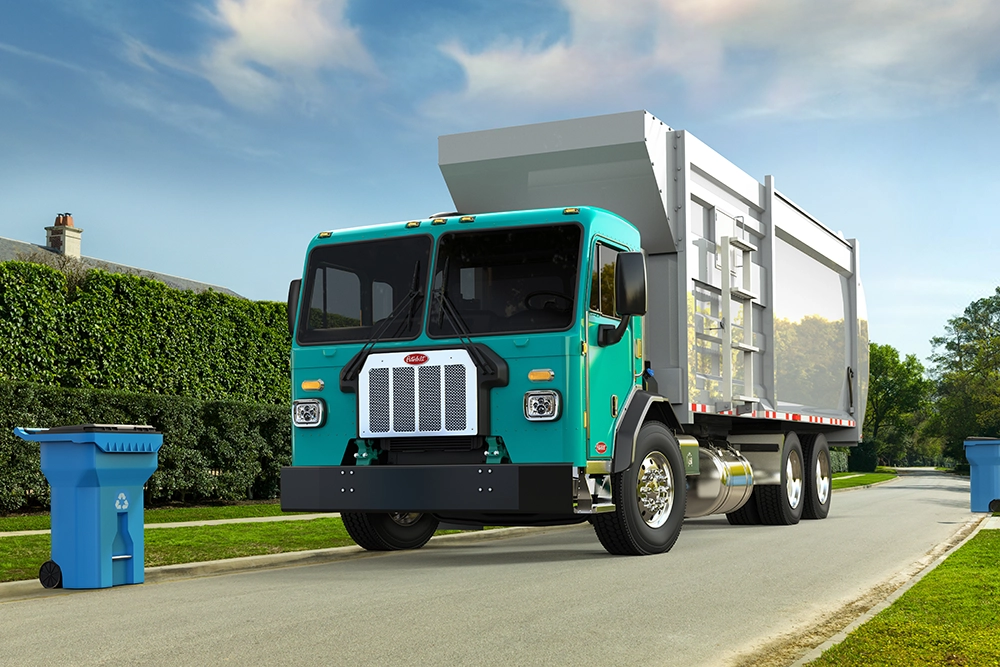 Used Peterbilt 520 side loader refuse truck exterior view
