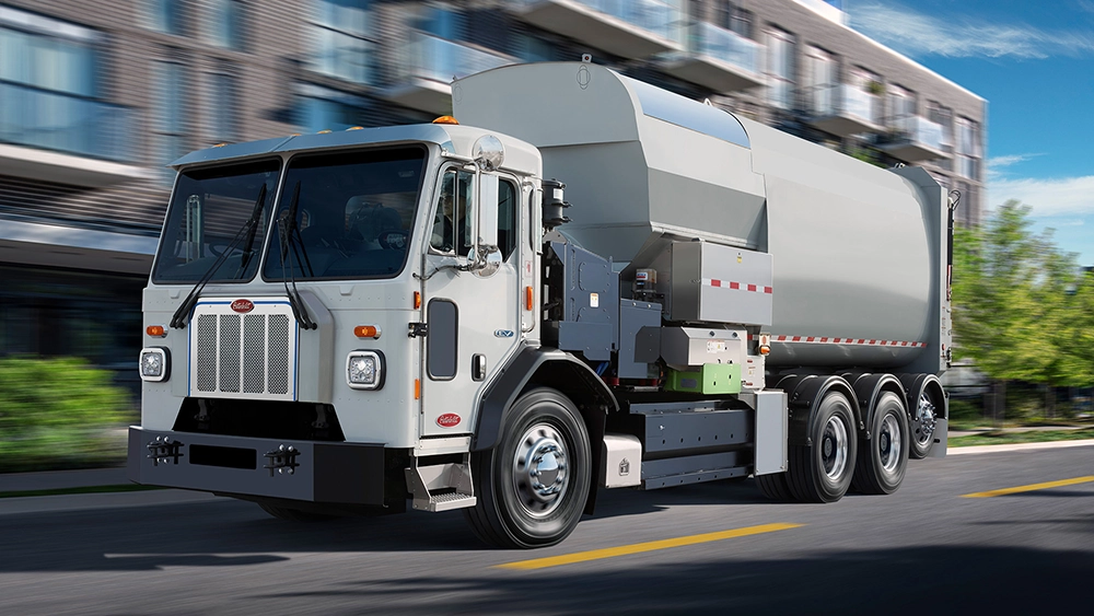 Used Peterbilt 520EV city refuse collection truck view