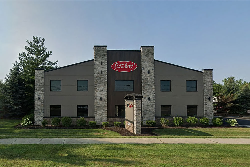 Exterior view of the new JX Truck Center and Peterbilt dealership building in Mokena, IL.