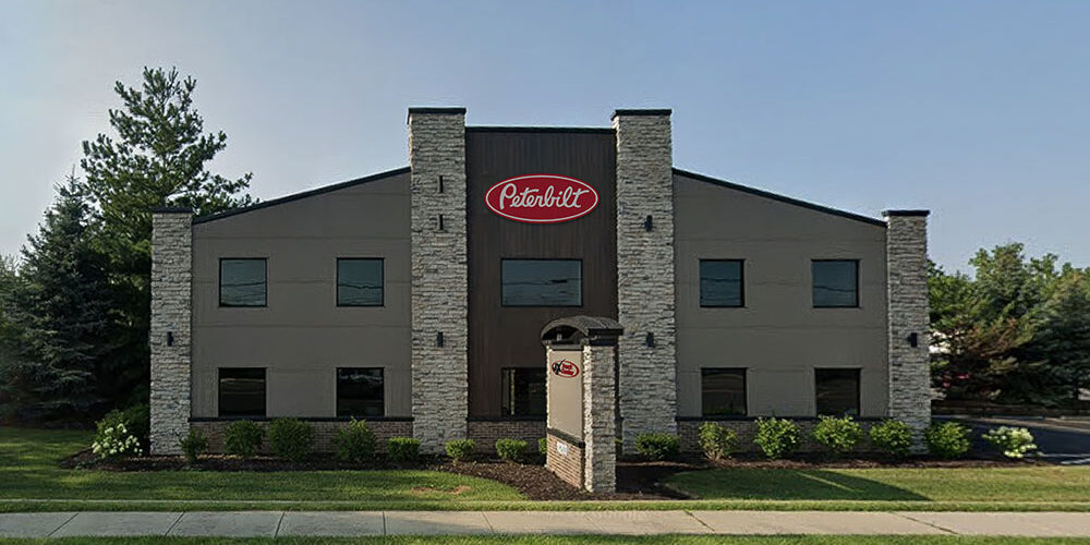 Exterior view of the new JX Truck Center and Peterbilt dealership building in Mokena, IL.